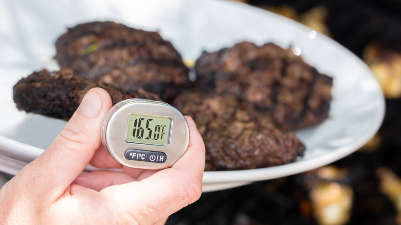 Food thermometer in burgers.