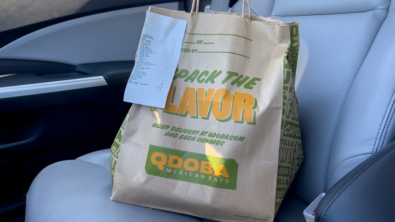 Qdoba bag sitting in carseat