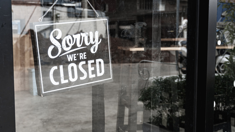 closed sign in business window