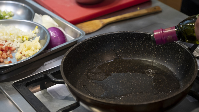 Pouring oil in pan