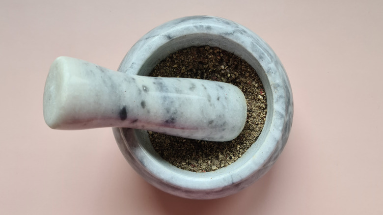 peppercorns in mortar and pestle