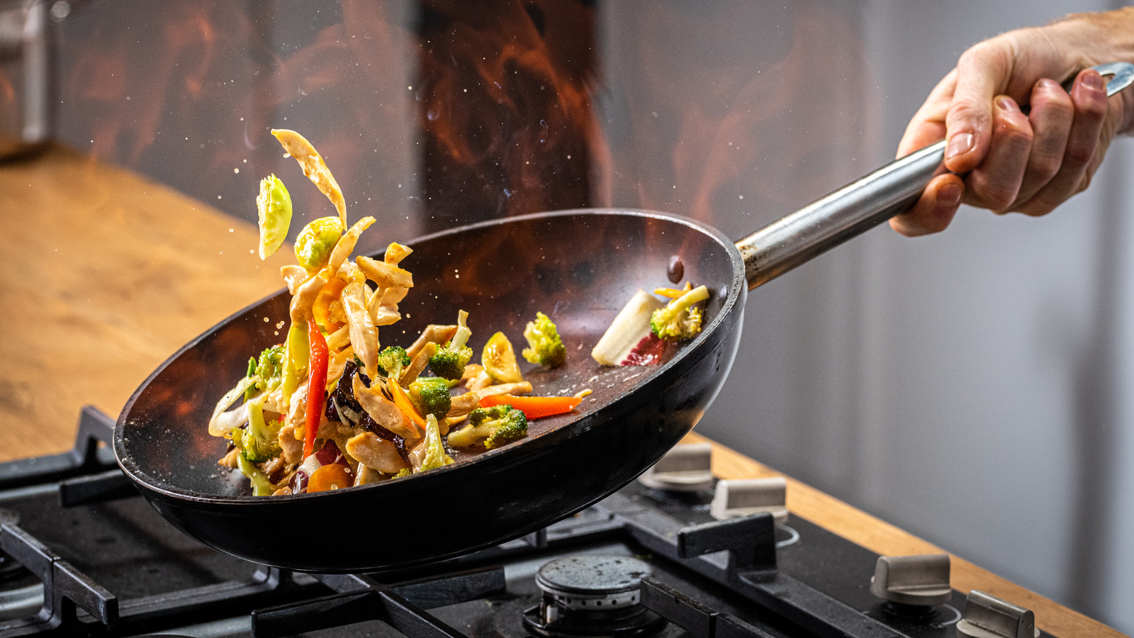 The First Tip You Need To Know For Tossing Food In The Skillet Like A Pro