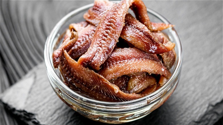 Cured anchovies in clear bowl 