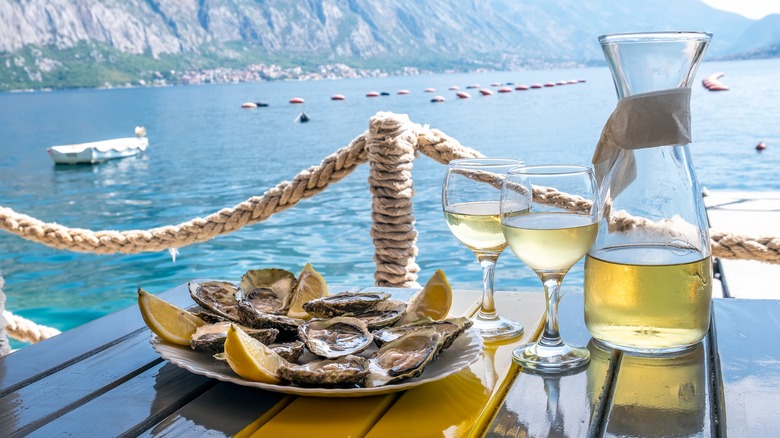 Oysters by the ocean with wine