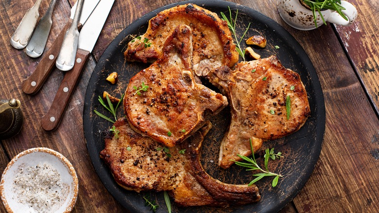 Pork chops on black plate