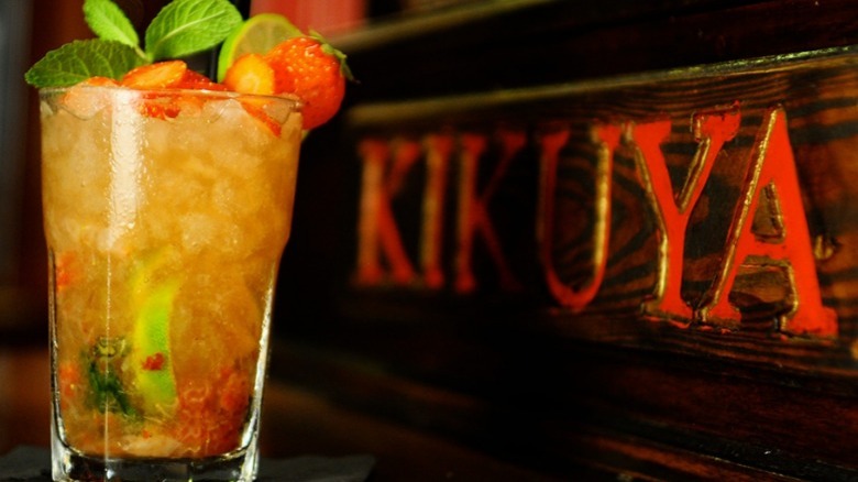 cocktail in front of Kikuya sign