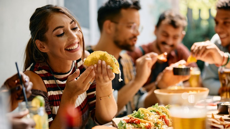 woman eating a taco