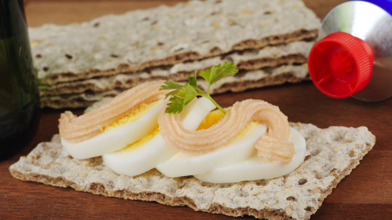 Crisp bread with boiled egg, caviar