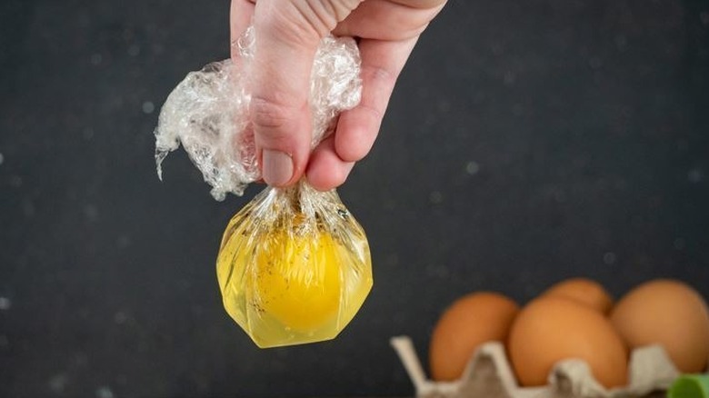 Fresh egg in a plastic wrap