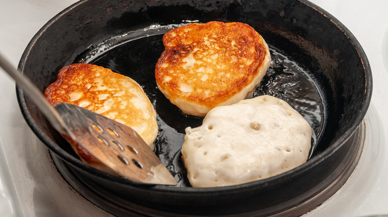 Pancakes frying in pan