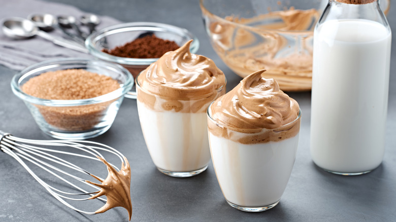 Two whipped coffee drinks with ingredients