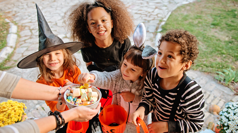 Kids in costumes trick-or-treating