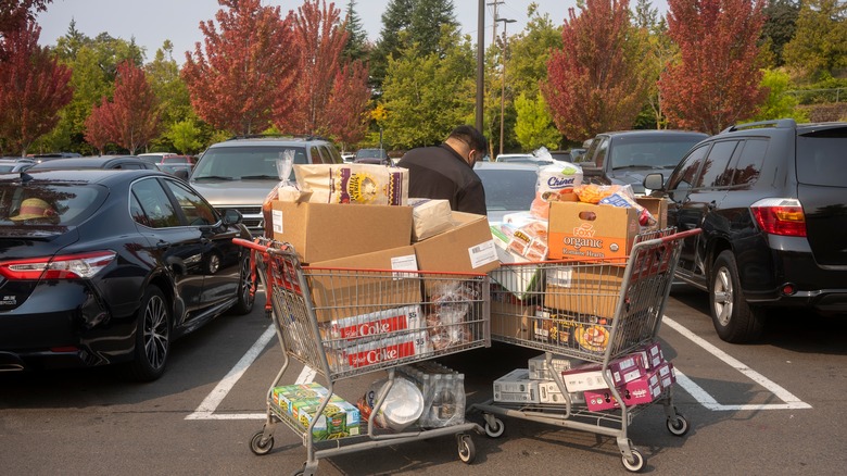 Costco member with shopping cart