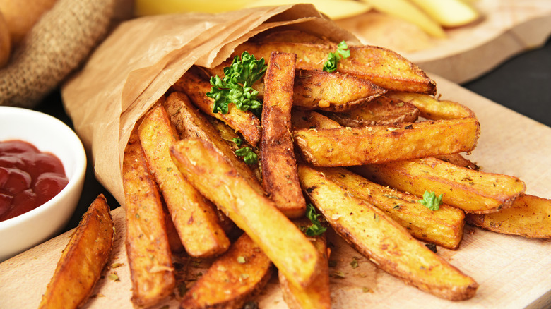 A batch of seasoned french fries