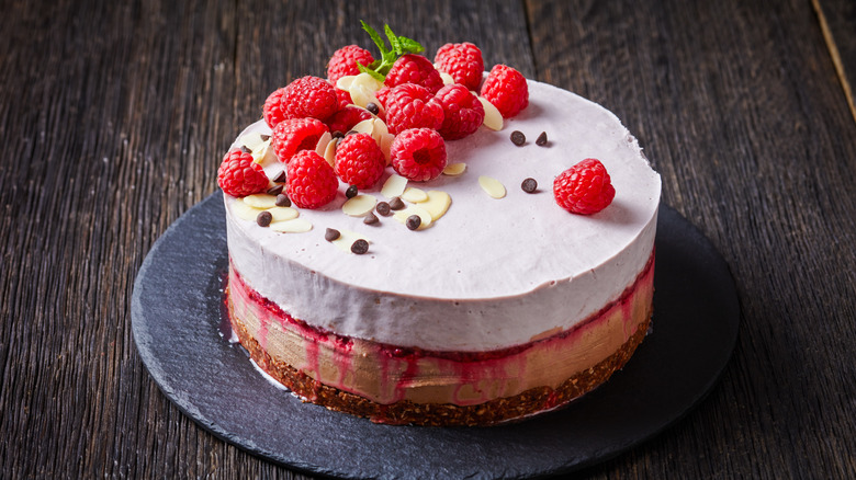 Layered ice cream cake with raspberry swirl