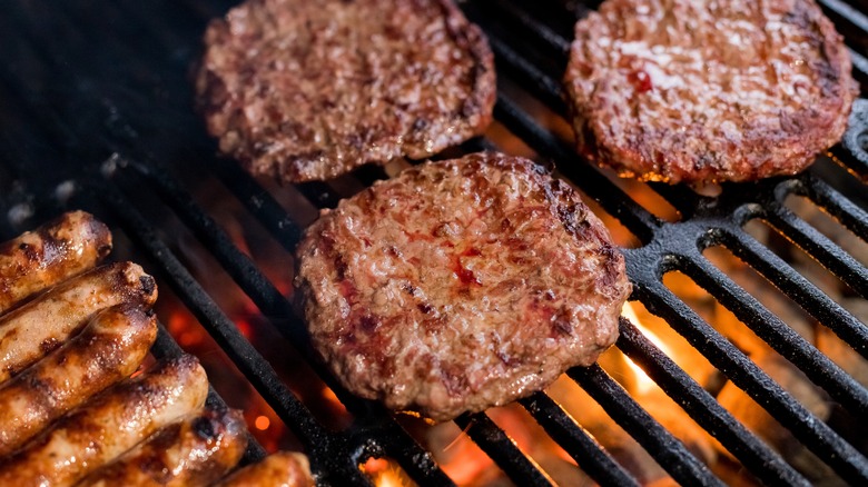 burgers and sausages grilling