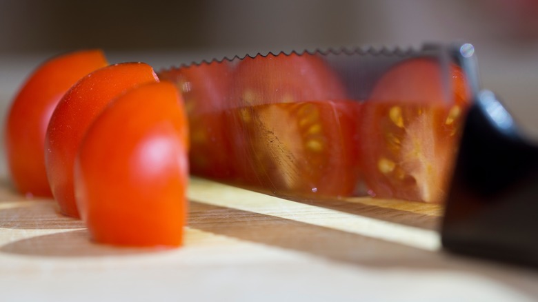 Sliced tomatoes and knife