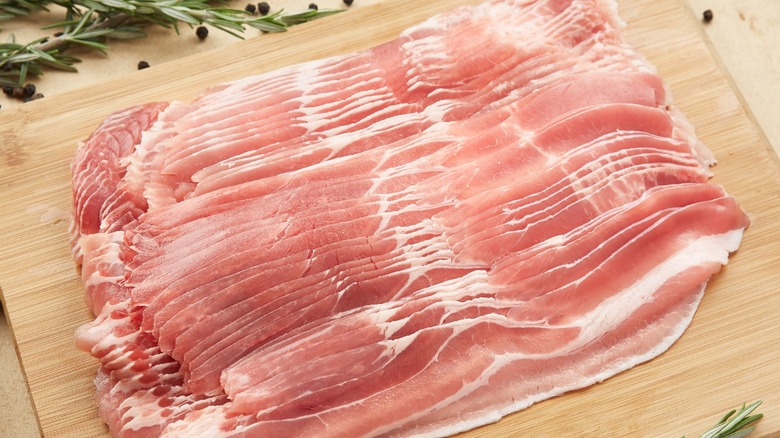 Slices of bacon on a cutting board