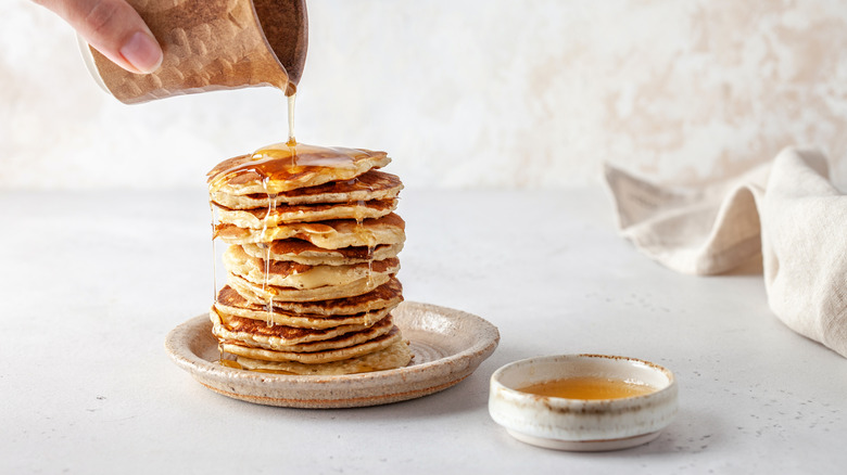 Stack of pancakes with syrup drizzle