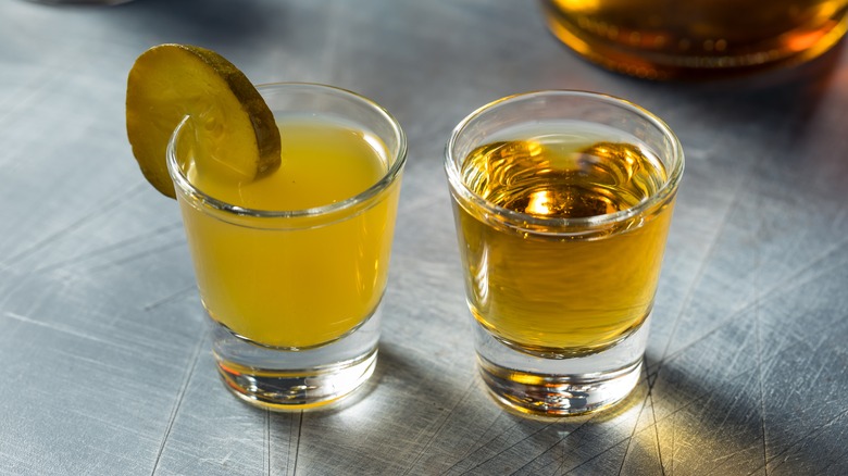 Pickleback shot with pickle garnish