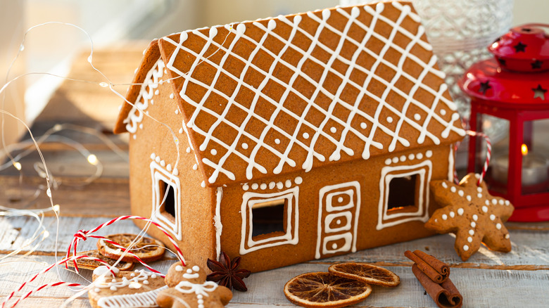 Gingerbread house surrounded by cookies