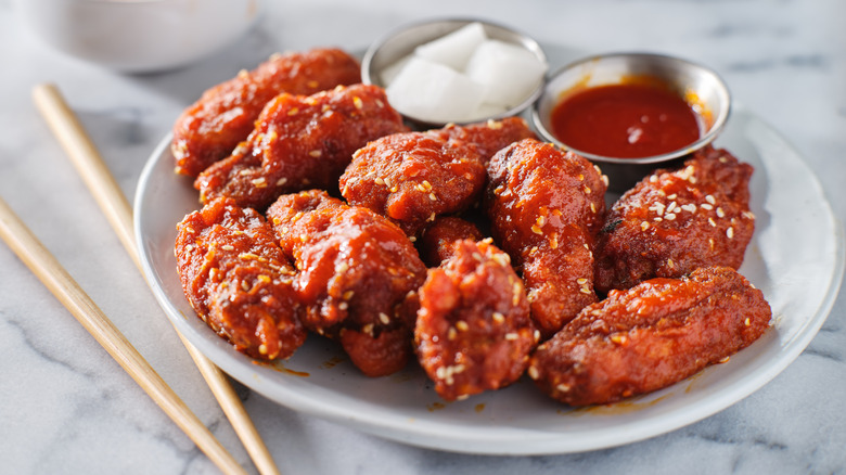 Chicken wings coated in gochujang sauce