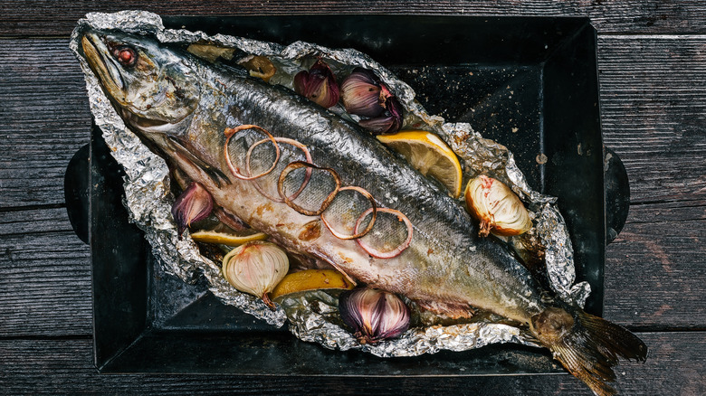 Whole roasted salmon in a tray