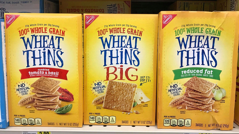 Three boxes of Wheat Thins on store shelf