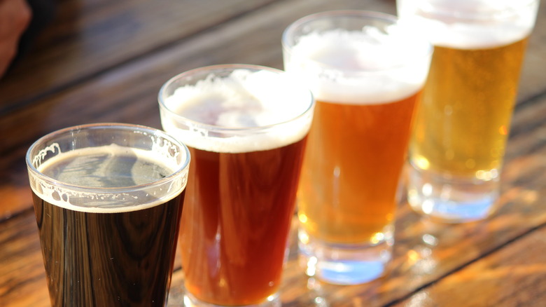 Four different beers in pint glasses