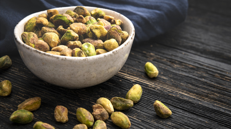 Bowl of pistachios overflowing