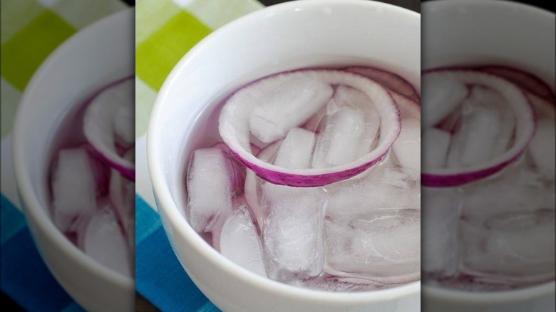 Red onion soaking in ice water 