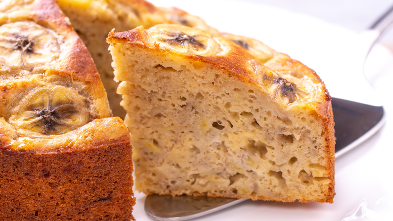 Slice of banana cake with banana slices on top