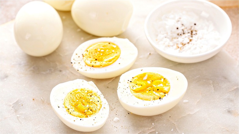 Halved hard-boiled eggs with salt 