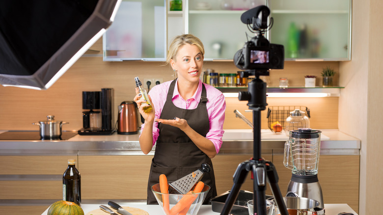 TV chef filming a show in a kitchen