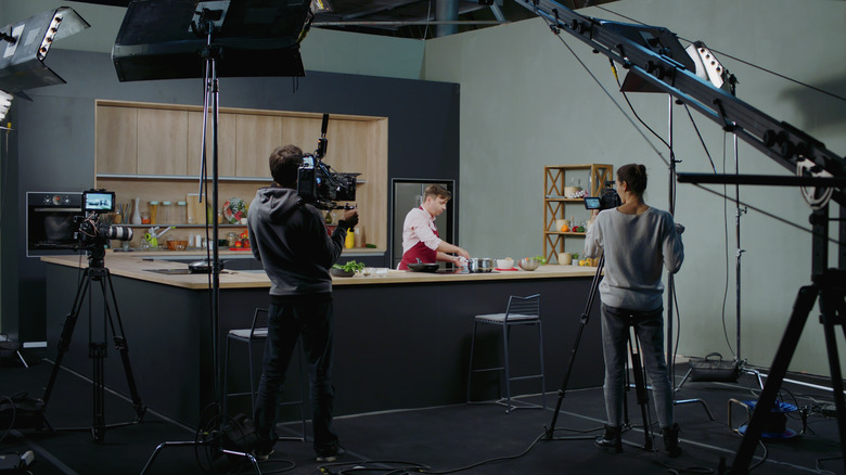 filming a TV chef as they prepare a meal