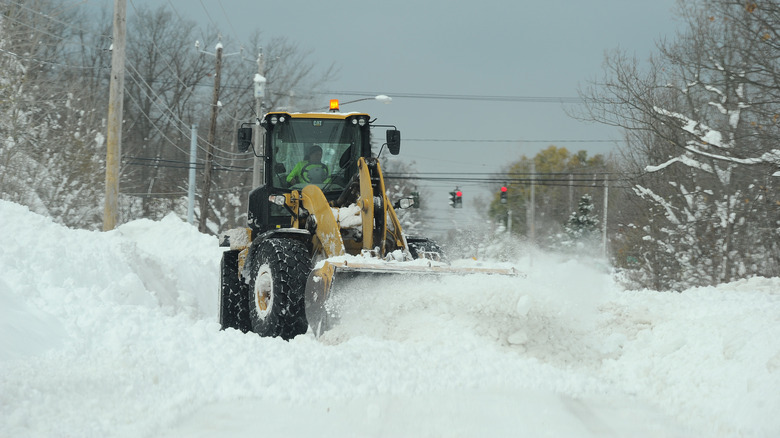 Snow plow in blizzard