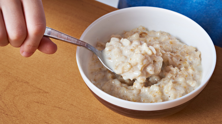 spoon in oatmeal bowl