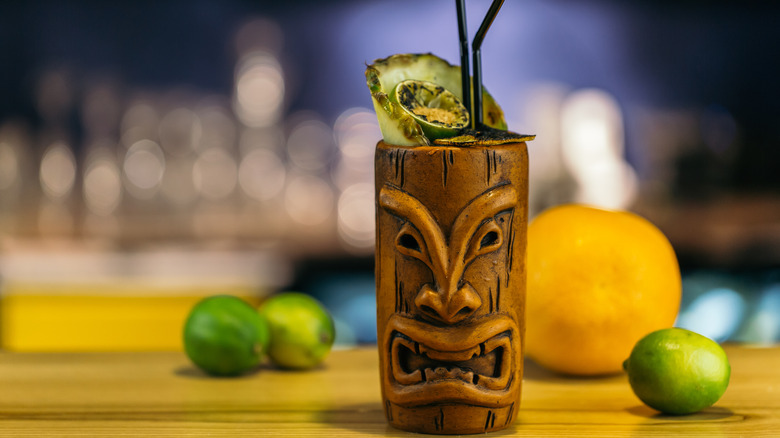 tiki mug with fruit and straw