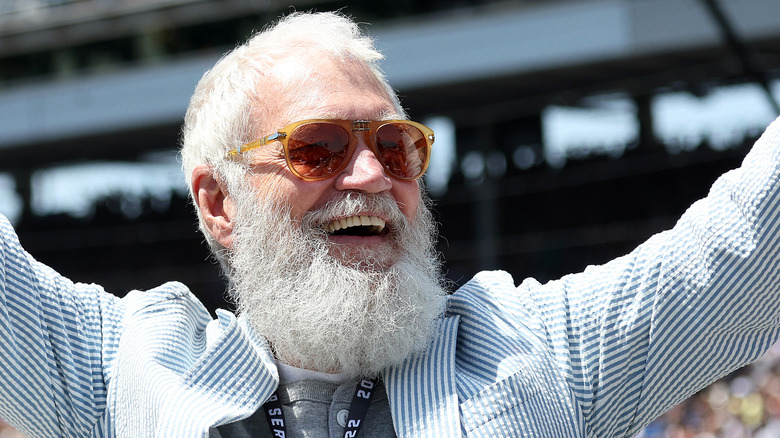 david letterman at indy 500 with sunglasses and wide smile