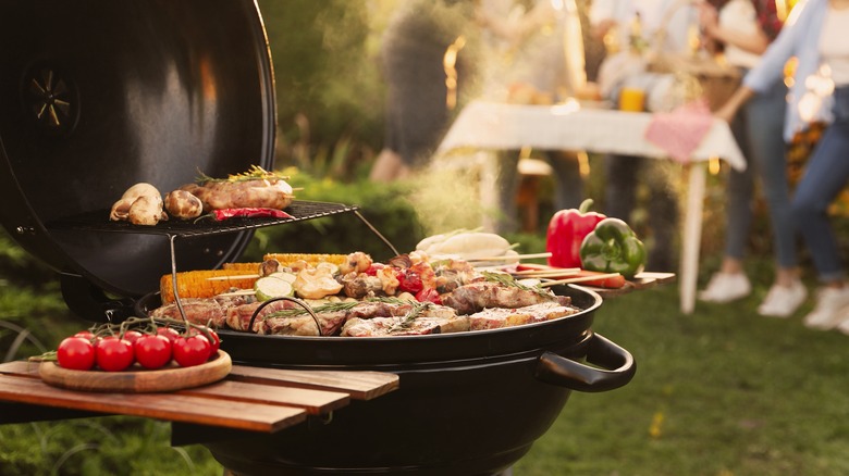 veggies and meat on a grill