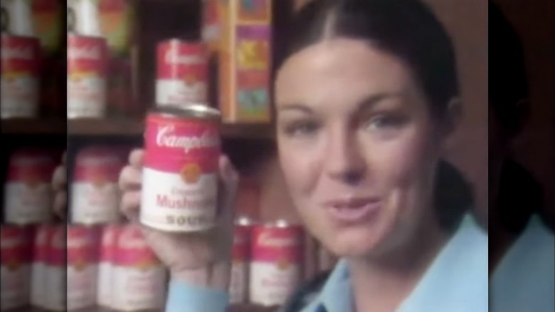 holding up campbell's soup can in ad from 1970s
