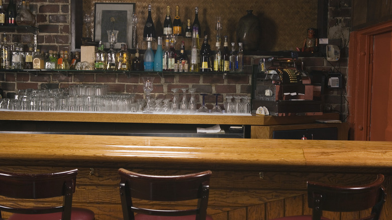 A full bar with empty chairs