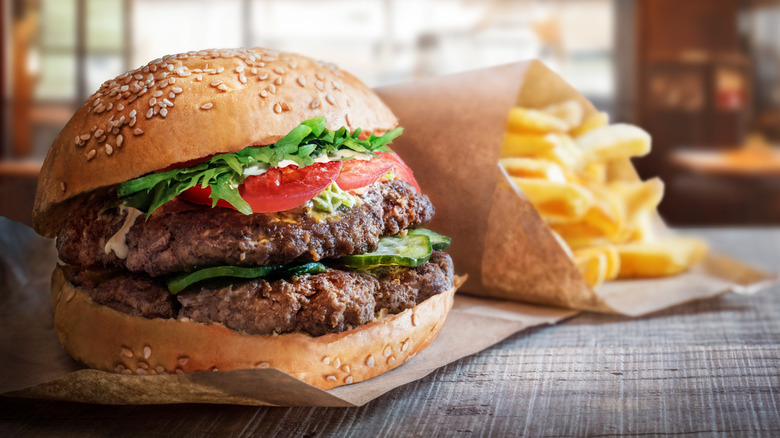 burger with out-of-focus fries