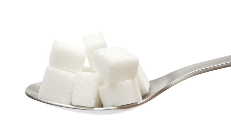 Sugar cubes on a spoon