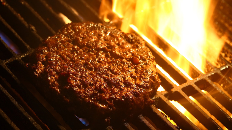 Burger patty grilling 