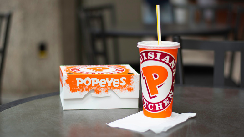 A popeyes box and drink