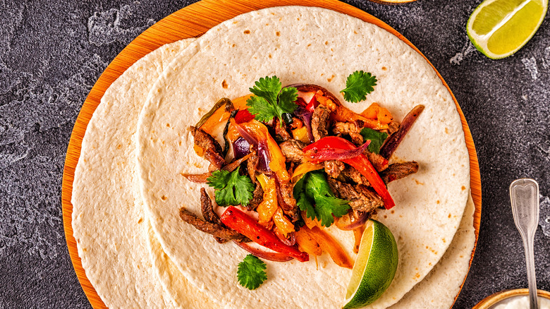 Tortillas stack with fajita meat