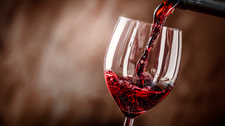 Wine being poured into a glass