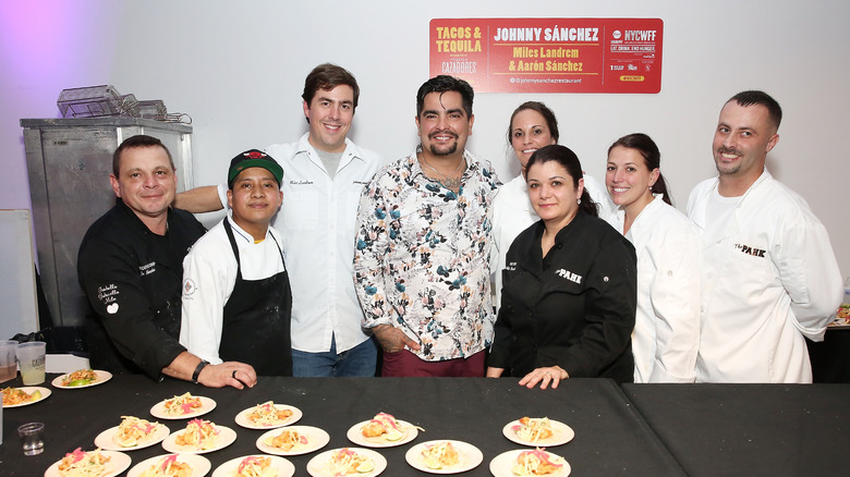 Aarón Sánchez posing with cooks