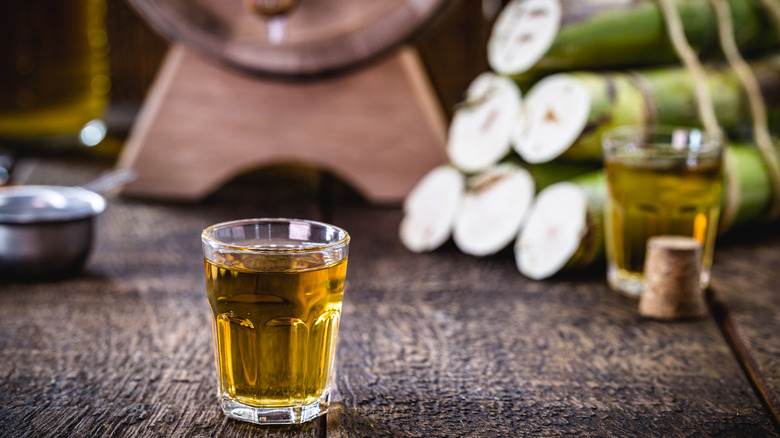 Glass of cachaça wooden table